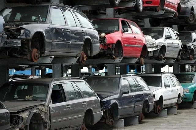 Old junk car ready for cash at HooknBook Towing